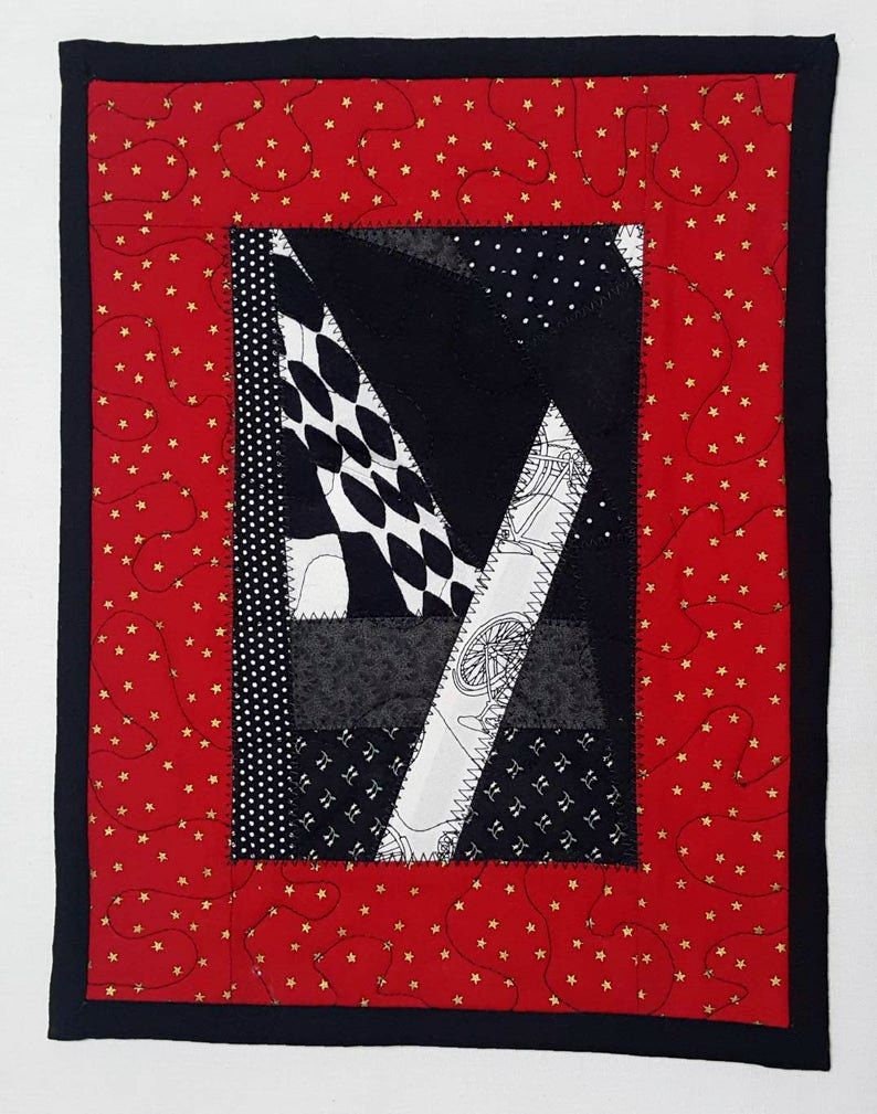 Quilted Patchwork Mug Rug: Red, Black, and Gold Star Print
