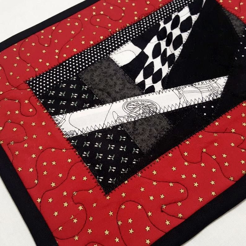 Quilted Patchwork Mug Rug: Red, Black, and Gold Star Print