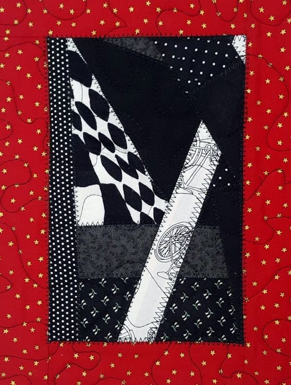 Quilted Patchwork Mug Rug: Red, Black, and Gold Star Print