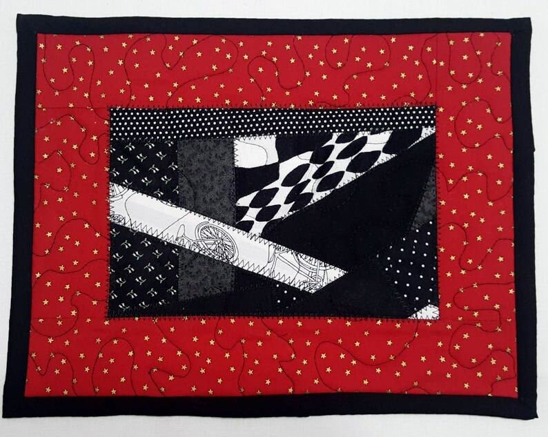 Quilted Patchwork Mug Rug: Red, Black, and Gold Star Print