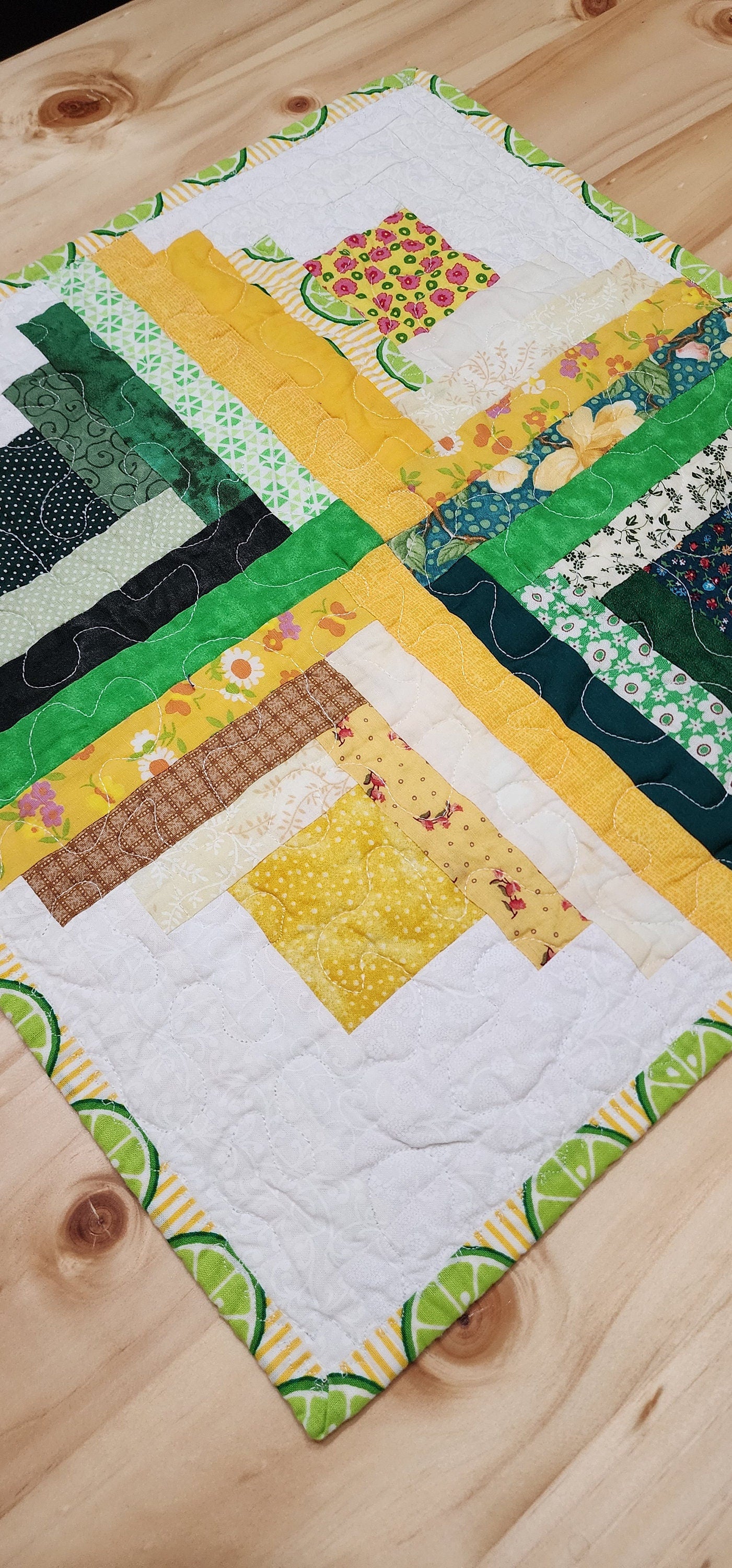 Patchwork Log Cabin Table Topper – 17" Square – Yellow & Green Quilted Mat