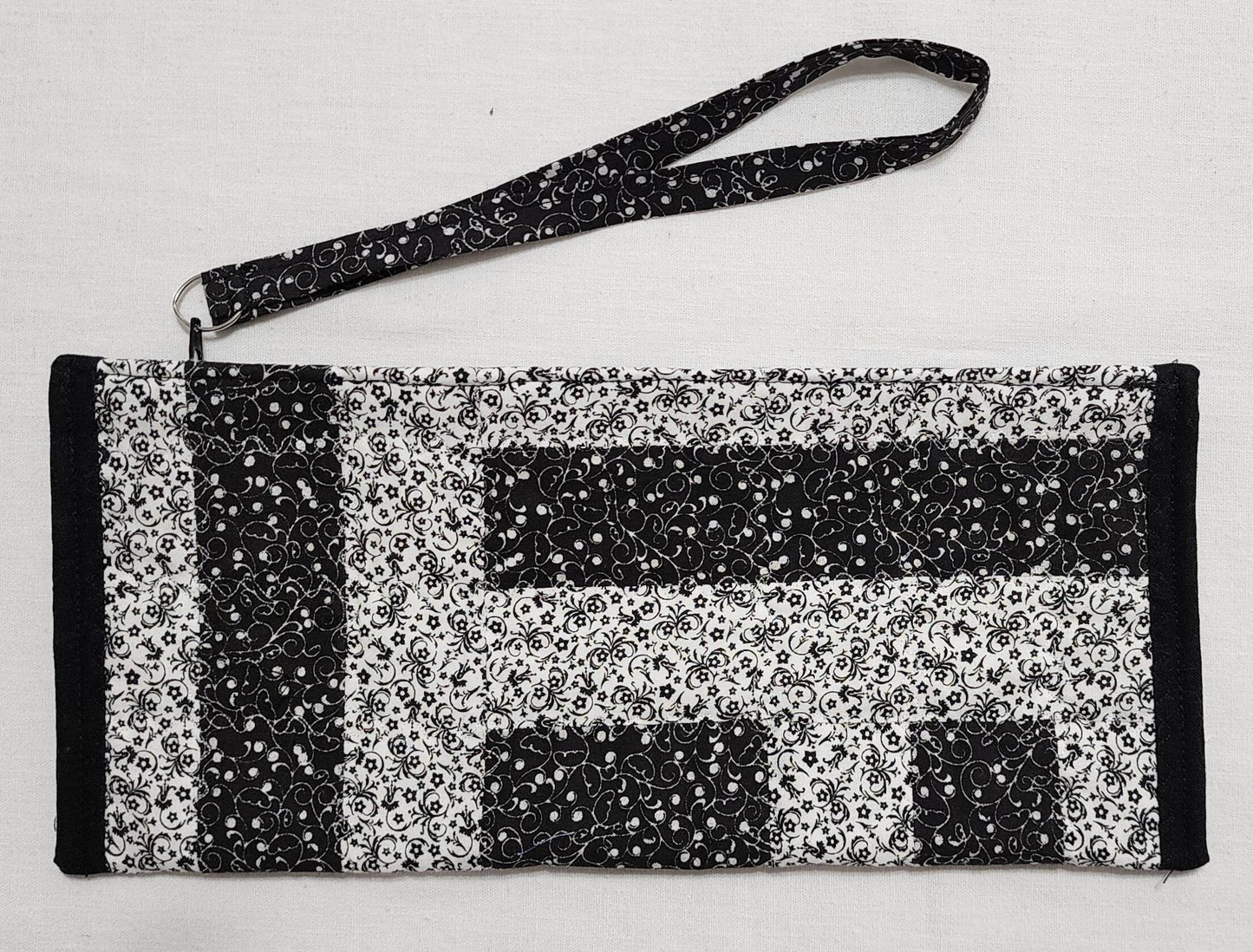 Patchwork Quilted Clutch: Black & White Travel Purse with Hand Strap
