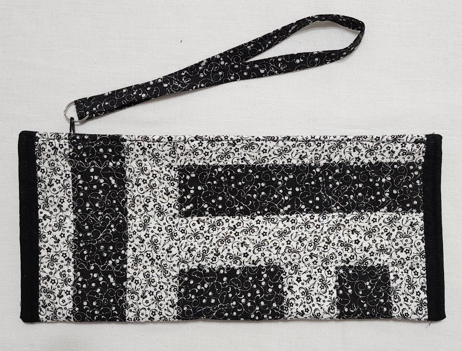 Patchwork Quilted Clutch: Black & White Travel Purse with Hand Strap