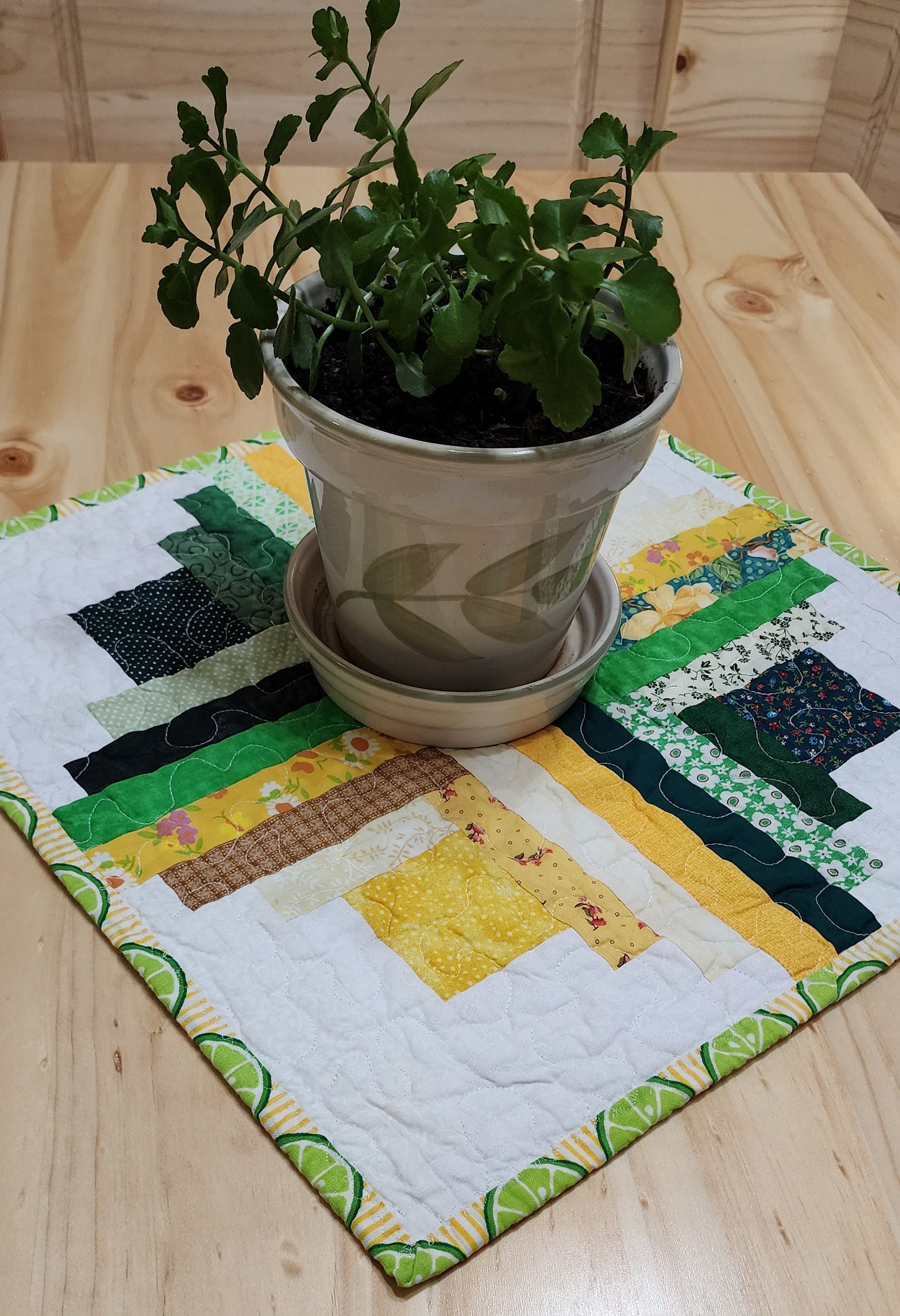 Patchwork Log Cabin Table Topper – 17" Square – Yellow & Green Quilted Mat